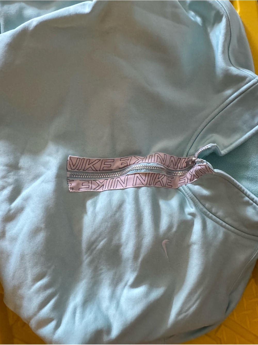 Nike women’s ' Light Blue Half-Zip Hoodie with Pink Logo Tape